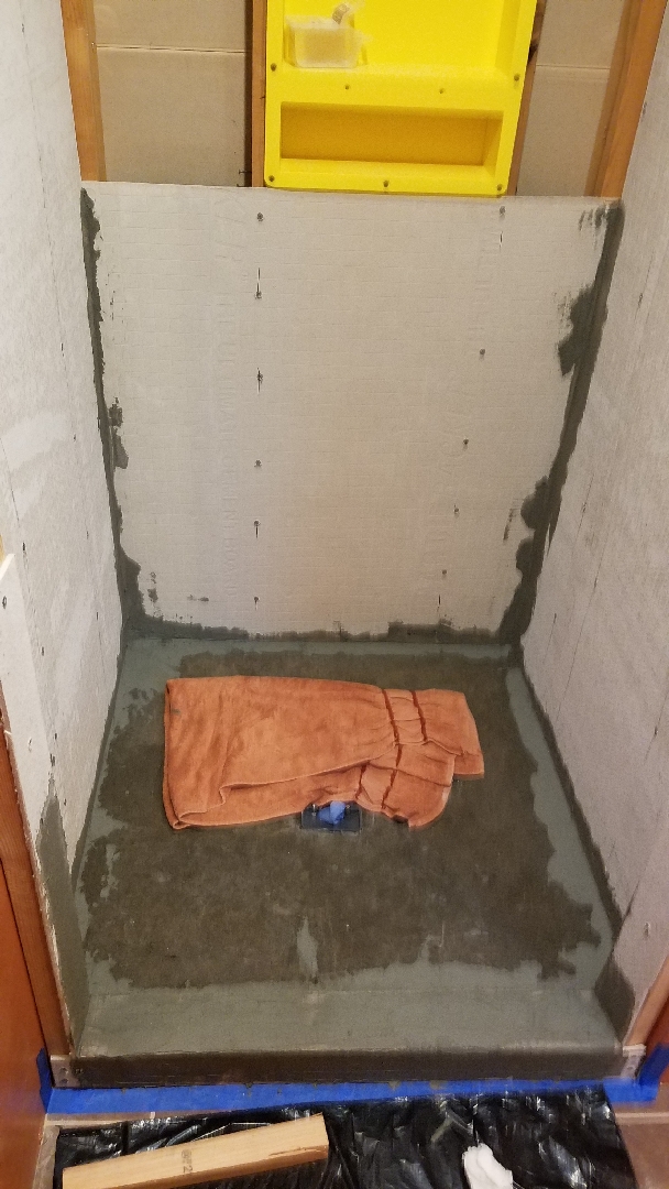 Sept. 3, 2018: Thinset applied in the corners to fill gaps and on the curb.